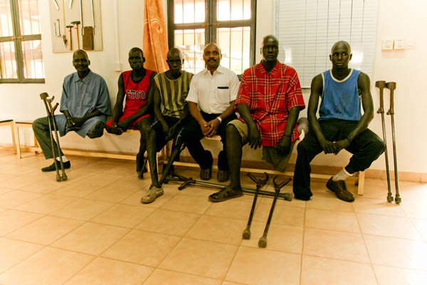 Five South Sudanese men with Suresh during their gait training at the Physical Rehabilitation Reference Centre in Juba, South Sudan